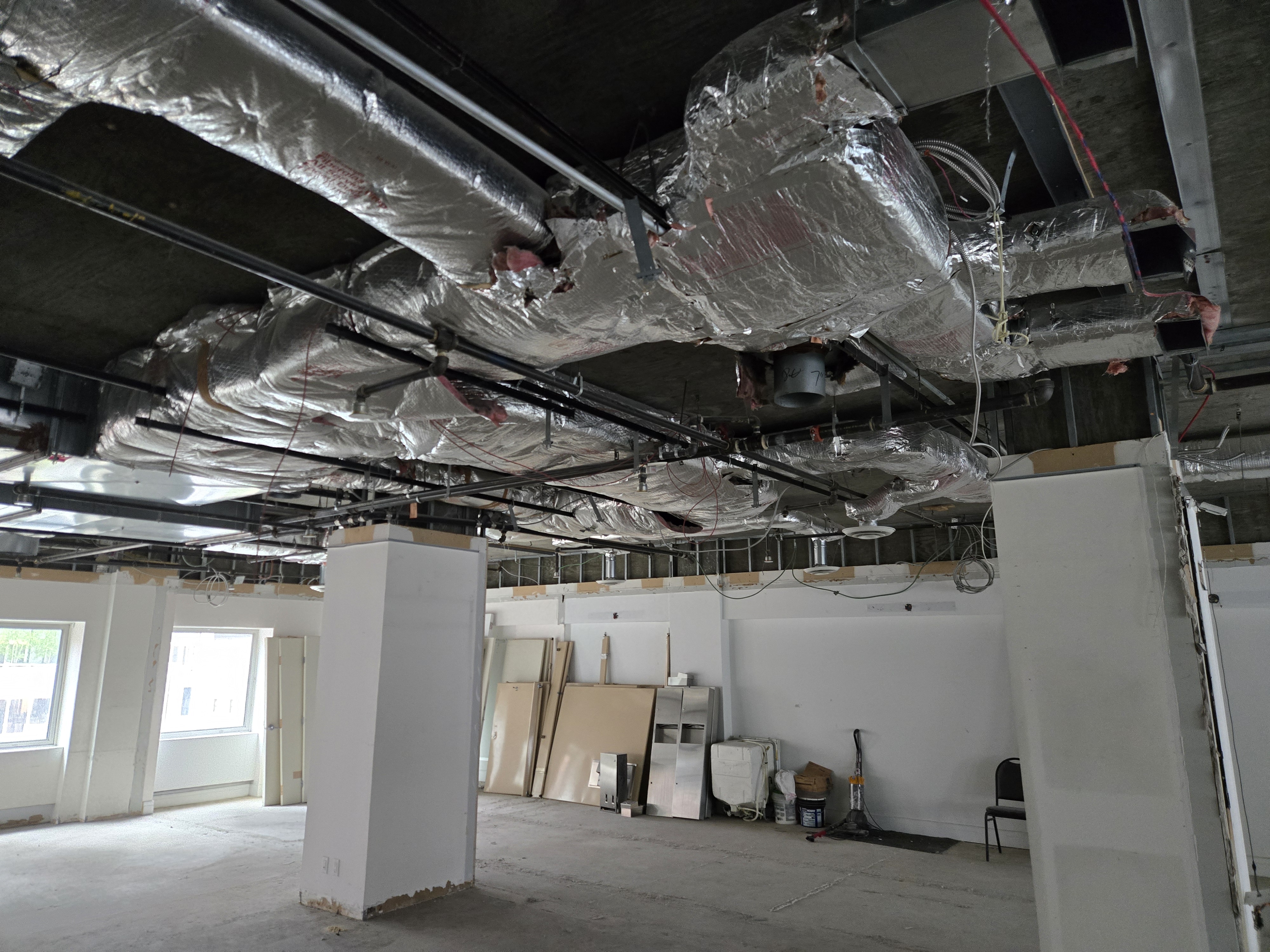 As-built site reality showing exposed HVAC and services