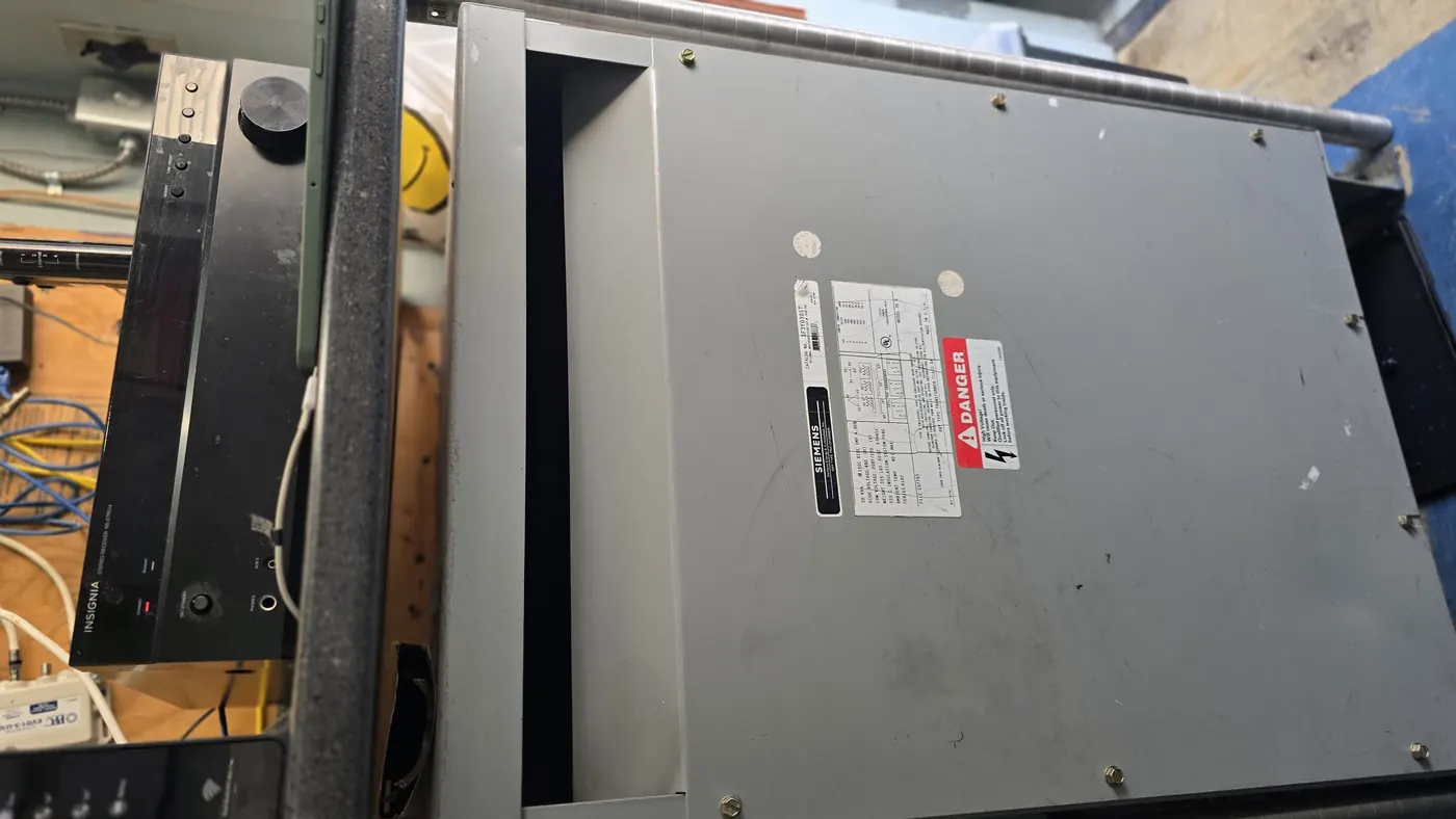 A step-down transformer in a commercial electrical room