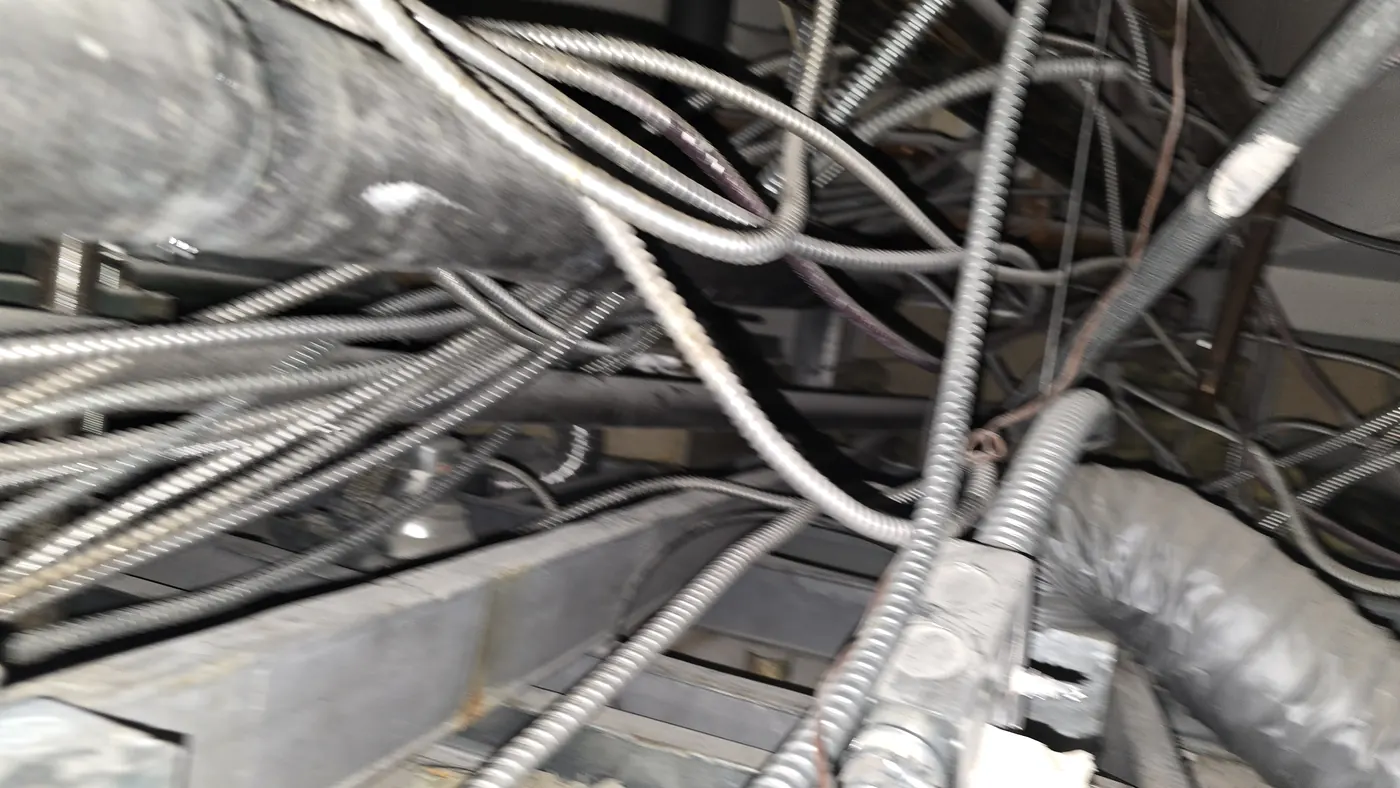 Congested services in a ceiling void above a suspended grid